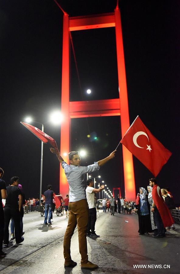 Thousands of Turks gathered on Thursday night on the bridge in Istanbul to denounce a failed coup attempt that killed at least 242 people and wounded 1,440 others last week.