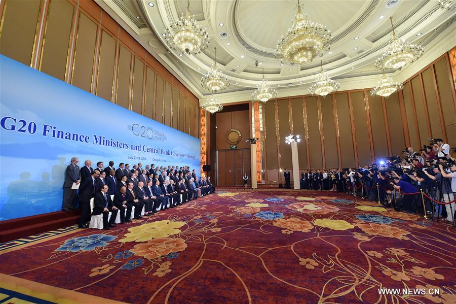 Participants pose for a group photo during a meeting of G20 finance ministers and central bank governors in Chengdu, capital of southwest China's Sichuan Province, July 24, 2016