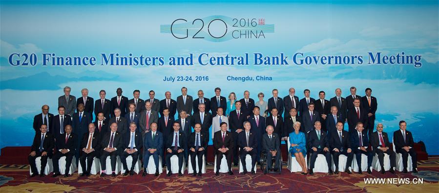 Participants pose for a group photo during a meeting of G20 finance ministers and central bank governors in Chengdu, capital of southwest China's Sichuan Province, July 24, 2016