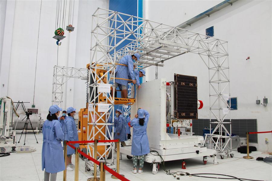 A solar wing deployment test for the experimental quantum communication satellite at the Jiuquan Satellite Launch Center. Image: Xinhua