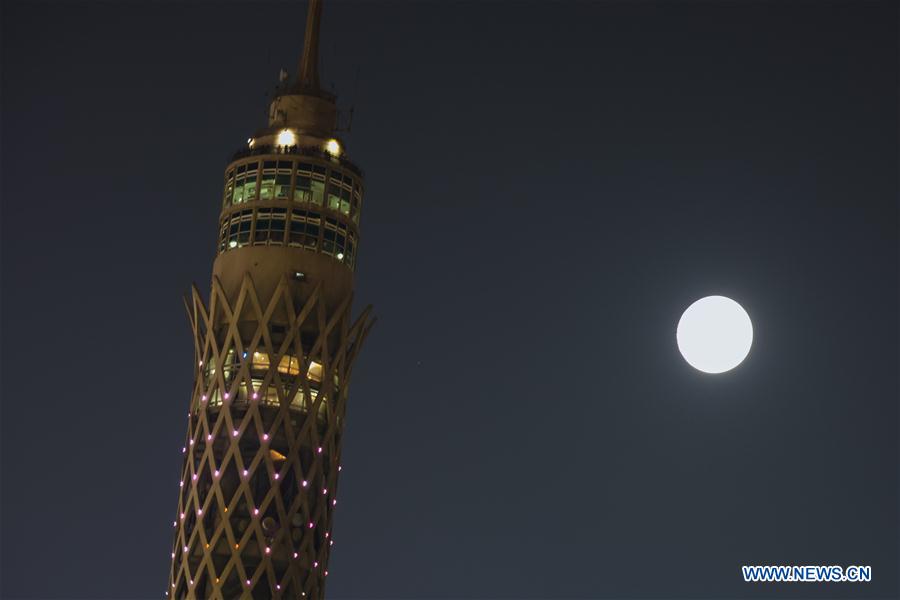 The multiple exposure photo shows the moon over the Cairo Tower during the Chinese Mid-Autumn Day in Cairo, Egypt, Sept. 15, 2016.