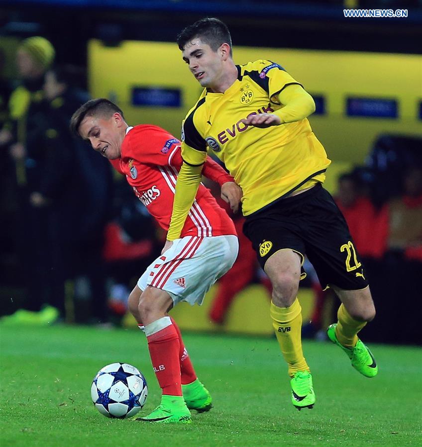 Christian Pulisic (R) of Borussia Dortmund vies for the ball during the UEFA Champions League Round of 16 second leg match between Borussia Dortmund and SL Benfica at Signal Iduna Park in Dortmund, Germany, on March 8, 2017.