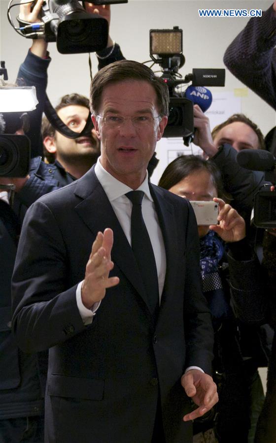 Dutch Prime Minister and People's Party for Freedom and Democracy VVD leader Mark Rutte arrives at a polling station to cast his ballot for the 2017 Dutch parliamentary elections in The Hague, the Netherlands, on March 15, 2017. 