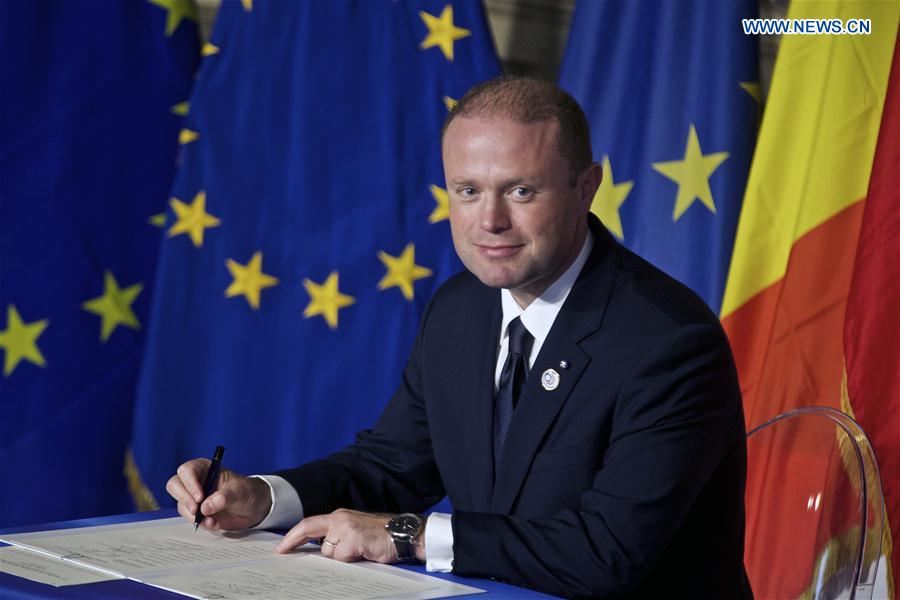 Malta's Prime Minister Joseph Muscat signs the 'Declaration of Rome' during a ceremony at Capitoline Hill in Rome, Italy, on March 25, 2017. 