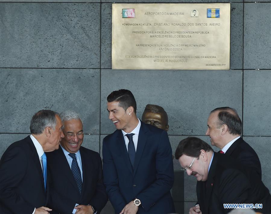 Portuguese footballer Cristiano Ronaldo (C) attends an airport renaming ceremony in Funchal March 29, 2017. Portugal on Wednesday renamed Madeira airport as Cristiano Ronaldo airport in honor of the captain of the Portuguese national football team. Funchal on Madeira Islands is the hometown of Cristiano Ronaldo. (Xinhua/Zhang Liyun) 