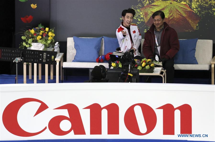 Jin Boyang (L) of China greets the spectators after Men Short Program at ISU World Figure Skating Championships 2017 in Helsinki, Finland on March 30, 2017. Jin took the fourth place after the short program with 98.64 points. (Xinhua/Liu Lihang)