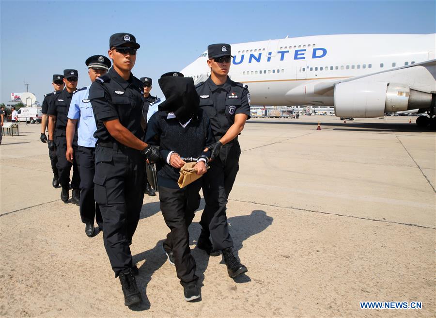 CHINA-BEIJING-UNITED STATES-WANTED SUSPECTS-HANDING OVER (CN)