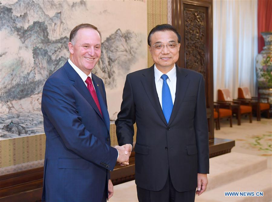 Premier Li says China to open wider to world