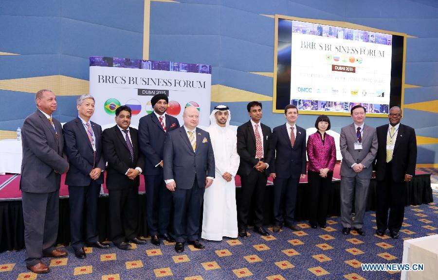 Diplomats and business executives from BRICS countries pose for a group photo during the BRICS forum held in Dubai, the United Arab Emirates (UAE) on Sept. 9, 2015.