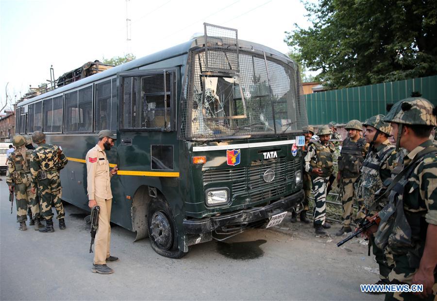 A member of India's Border Security Force (BSF) inspects a damaged convoy which was attacked by militants in Bijbehera town of Anantnag district, about 44 km south of Srinagar city, the summer capital of Indian-controlled Kashmir, June 3, 2016.