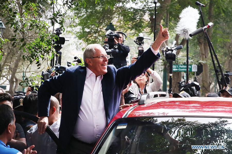 Image taken on June 5, 2016 shows the presidential candidate of the party Peruvians for Change (PPK), Pedro Pablo Kuczynski, greeting after casting his vote in the second round of the presidential elections, in the San Isidro district, in Lima, Peru. 