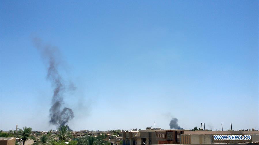 Smoke rises after the U.S.-led coalition warplanes struck Islamic State (IS) militants in Fallujah city, some 50 km west of Baghdad, Iraq, on June 11, 2016.