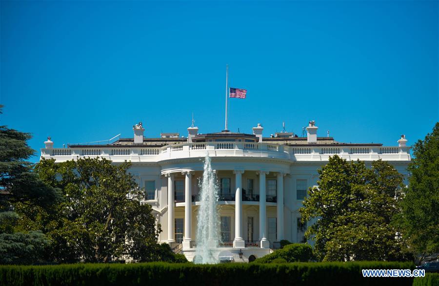 The U.S. national flag flies at half-mast at the White House to mourn the victims of the mass shooting at a gay night club in Orlando, in Washington D.C., the United States, June 12, 2016. 