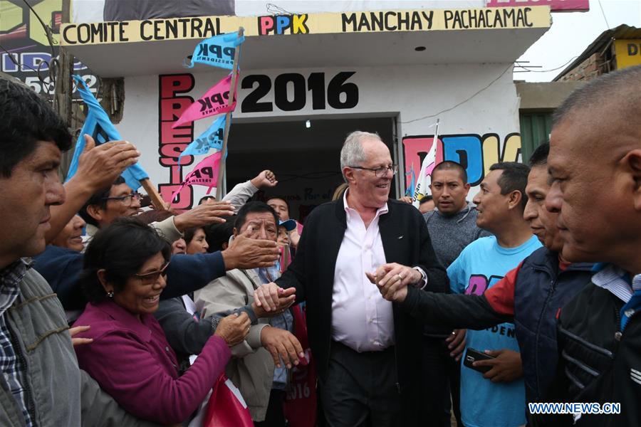 sident-elect of Peru Pedro Pablo Kuczynski (R) greets the residents during a visit to the zone of Manchay, where he participated in a thanksgiving mass, in the Pachacamac District, in Lima, Peru, on June 12, 2016.