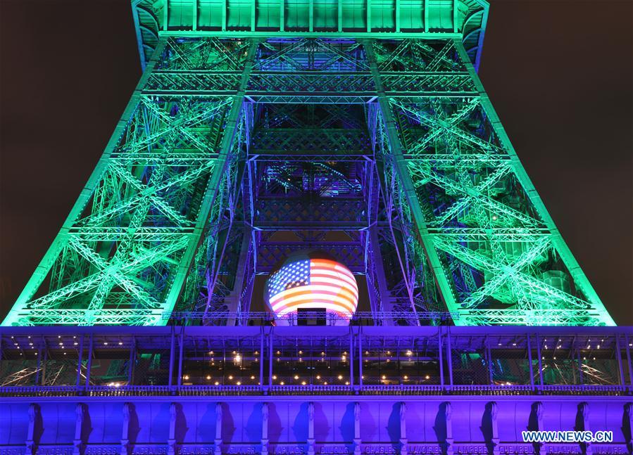 The Eiffel Tower is illuminated in the colors of the rainbow to pay tribute to Orlando nightclub shooting victims, in Paris, France, June 13, 2016. 