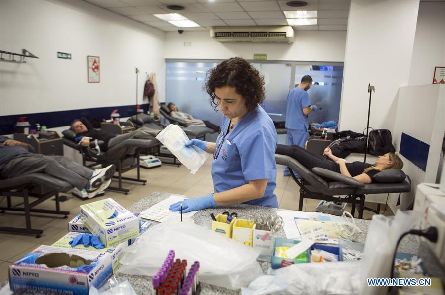 Image taken on June 10, 2016 shows bags with donated blood that will be divided in red globules, plasma and platelets in the laboratory of the Buenos Aires 'Hemocentro' (Blood Center) Foundation, in Buenos Aires, capital of Argentina.