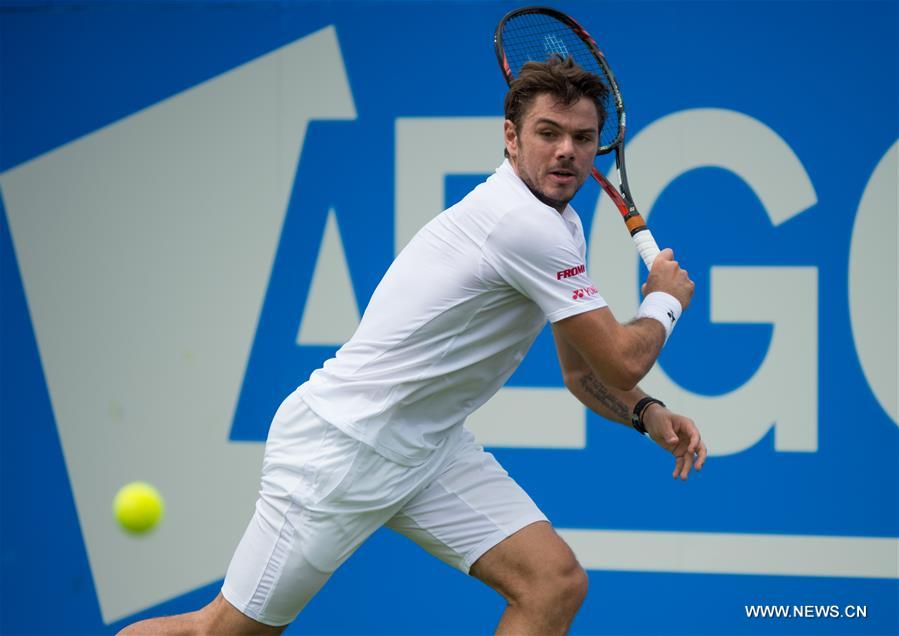 (Stan Wawrinka of Switzerland returns a shot during his singles first round match against Fernando Verdasco of Spain during day two of the ATP-500 Aegon Championships at the Queen's Club in London, Britain on June 14, 2016