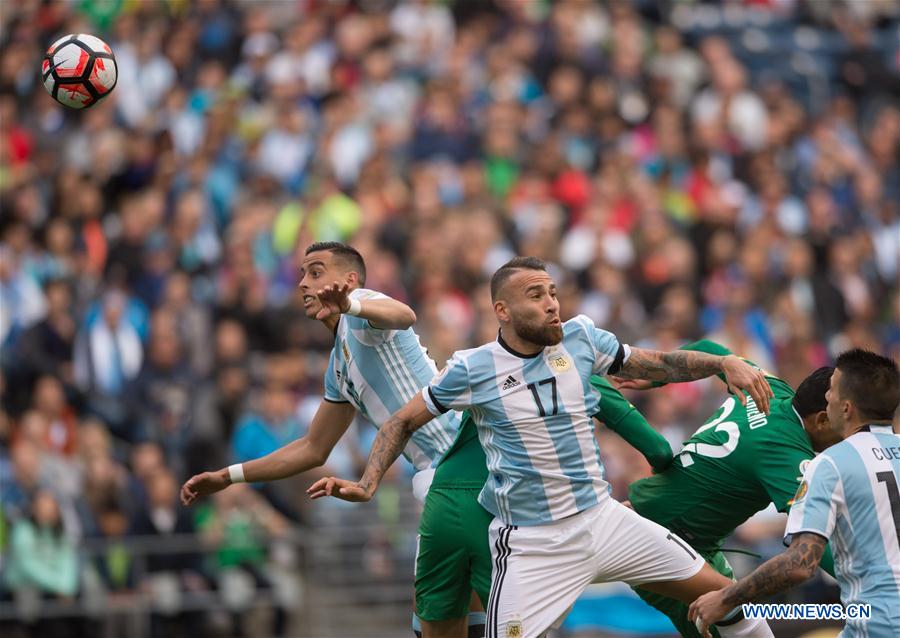 Nicholas Otamendi (2nd L) of Argentina vies for the ball during a Copa America Group D soccer match against Bolivia in Seattle, the United States, on June 14, 2016. 