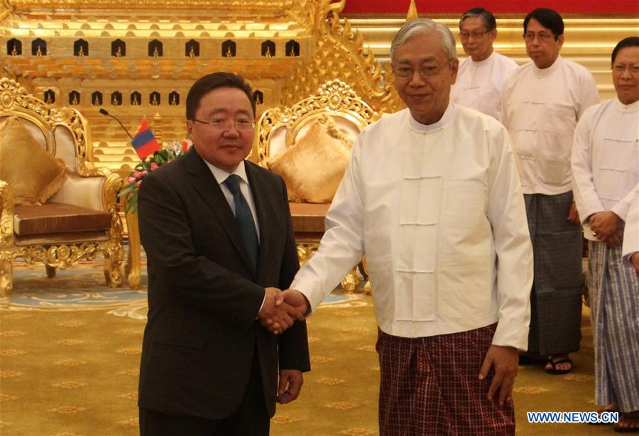 Myanmar's President U Htin Kyaw (R, front) shakes hands with Mongolian President Tsakhiagiin Elbegdorj in Nay Pyi Taw, Myanmar, on June 15, 2016
