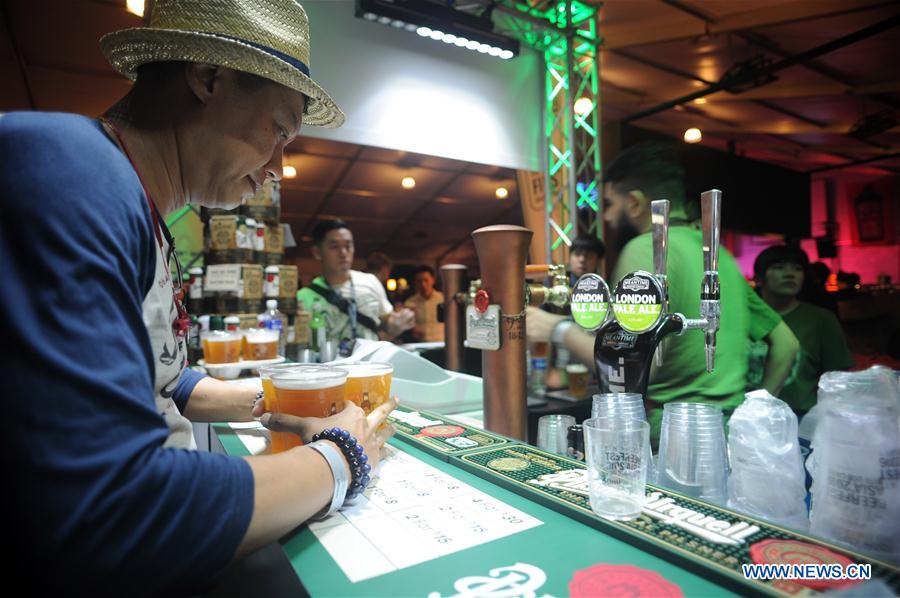 Drinkers enjoy beer at the Beerfest Asia held at Singapore Flyer F1 track, June 16, 2016.