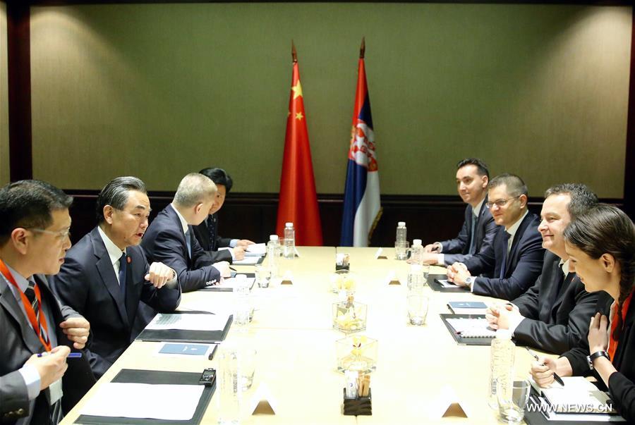 Chinese Foreign Minister Wang Yi (2nd-L) holds talks with Ivica Dacic (2nd-R), Serbia's first deputy prime minister and foreign minister, in Belgrade, Serbia, June 17, 2016