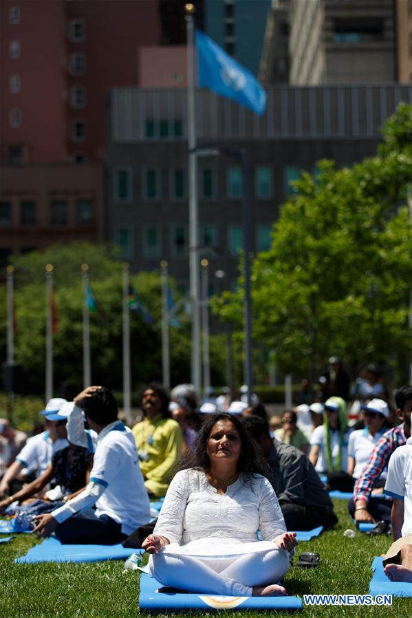 People attend the celebration of the 2016 International Day of Yoga at the United Nations headquarters in New York, June 21, 2016. 