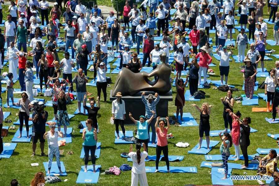 People attend the celebration of the 2016 International Day of Yoga at the United Nations headquarters in New York, June 21, 2016. 