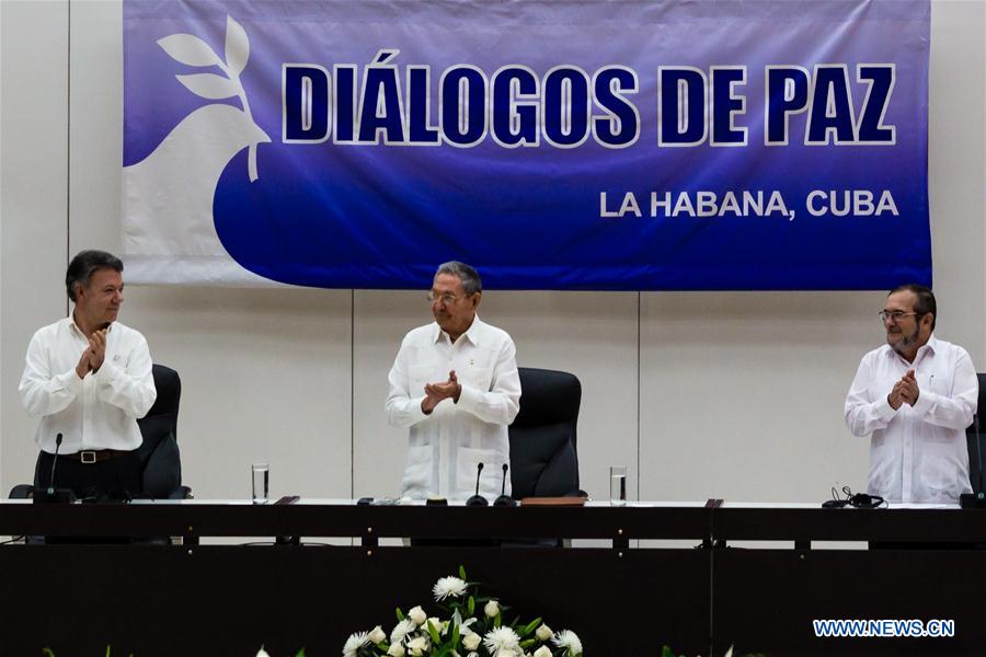 The Colombian government and the FARC guerrilla group signed a pact on a definitive bilateral ceasefire, marking a major step towards ending a half-century conflict. The conflict had killed more than 220,000 people and displaced millions since 1964.