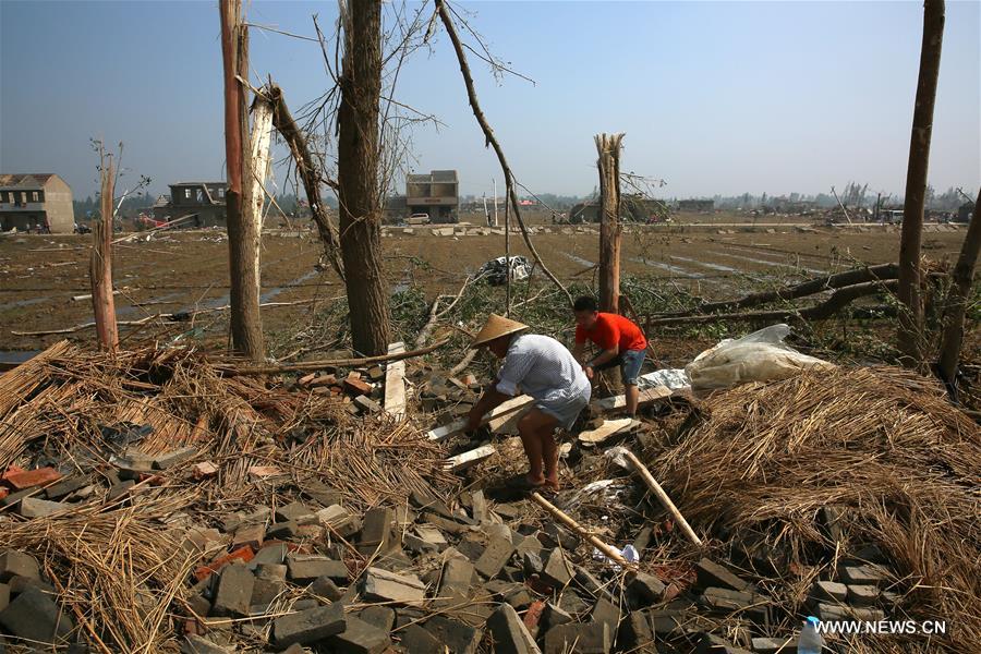 Rain, hail and a tornado battered parts of Yancheng City on Thursday afternoon, destroying buildings, trees, vehicles and electricity poles. At least 98 people have died and 846 were injured. 
