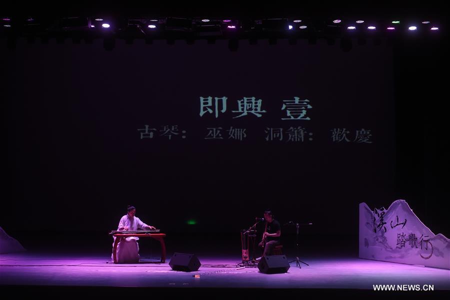 Musicians Wu Na and Huan Qing held the concert here on Saturday to show the charm of the traditional Chinese music with traditional musical instruments.