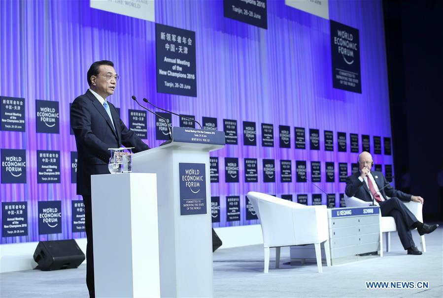 Chinese Premier Li Keqiang addresses the opening ceremony of the Annual Meeting of the New Champions 2016, or Summer Davos Forum, in Tianjin, north China, June 27, 2016.