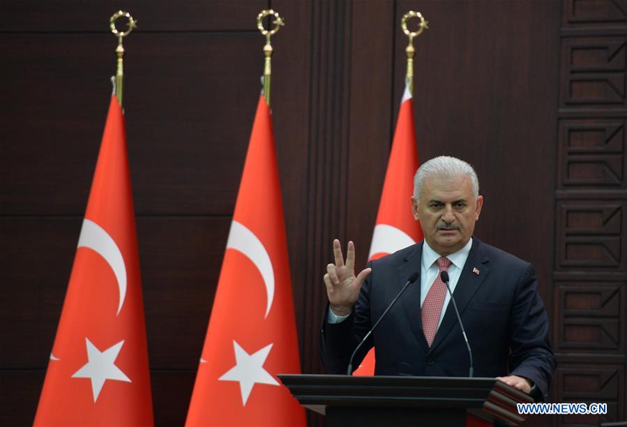 Turkish Prime Minister Binali Yildirim delivers a speech during a press conference after a Turkish-Israeli meeting, in Ankara, Turkey, on June 27, 2016.