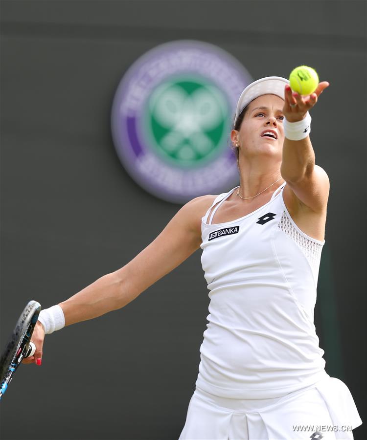 Jana Cepelova of Slovakia serves during the women's singles second round match with Garbine Muguruza of Spain on Day 4 at the Wimbledon Championships 2016 in London, Britain, on June 30, 2016. 