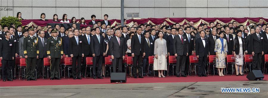 Tung Chee-hwa (6th L F), vice chairman of the National Committee of the Chinese People's Political Consultative Conference, Leung Chun-ying (7th L F), chief executive of Hong Kong Special Administrative Region (HKSAR), and Zhang Xiaoming (5th L F), head of the Liaison Office of the Central People's Government in Hong Kong, attend the national flag raising ceremony at the Golden Bauhinia Square in Hong Kong, south China, July 1, 2016, to celebrate the 19th anniversary of the establishment of the HKSAR. (Xinhua/Lui Siu Wai) 