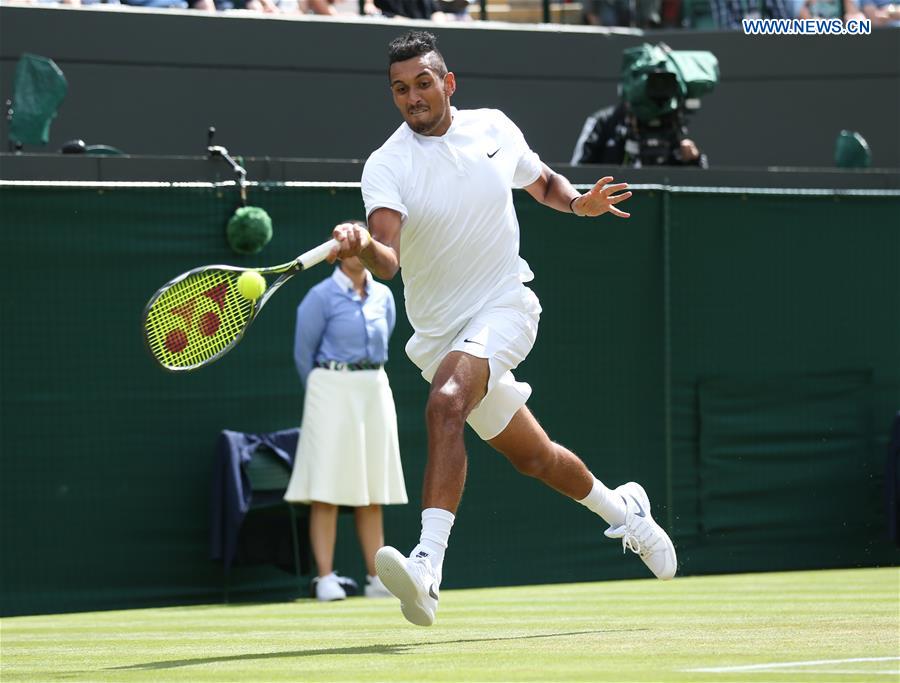 Nick Kyrgios of Australia hits the ball during the men's singles third round match with Feliciano Lopez of Spain on Middle Sunday at The 2016 Wimbledon Championships in London, Britain on July 3, 2016. 