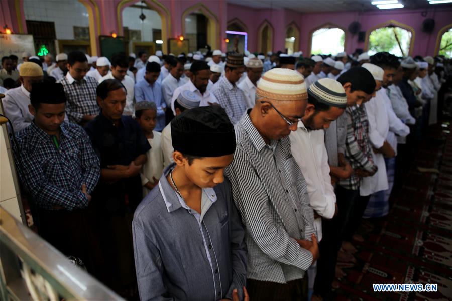 Muslim devotees pray on the Eid al-Fitr at a mosque in Yangon, Myanmar, on July 7, 2016, which marks the end of Islam's holy month of Ramadan. 
