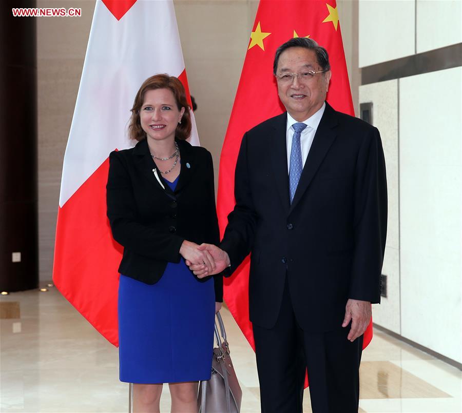 Yu Zhengsheng (R), chairman of the National Committee of the Chinese People's Political Consultative Conference (CPPCC), meets with President of the National Council of Switzerland Christa Markwalder, who is visiting China to attend the Eco Forum Global Annual Conference 2016, in Guiyang, capital of southwest China's Guizhou Province, July 8, 2016.