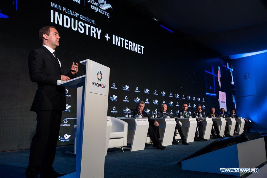 Russian Prime Minister Dmitry Medvedev speaks at the main plenary session 'Industry+Internet' during the International Industrial Trade Fair, or INNOPROM, in Yekaterinburg, Russia, on July 11, 2016.
