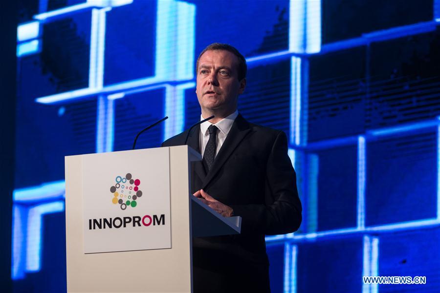 Russian Prime Minister Dmitry Medvedev speaks at the main plenary session 'Industry+Internet' during the International Industrial Trade Fair, or INNOPROM, in Yekaterinburg, Russia, on July 11, 2016.