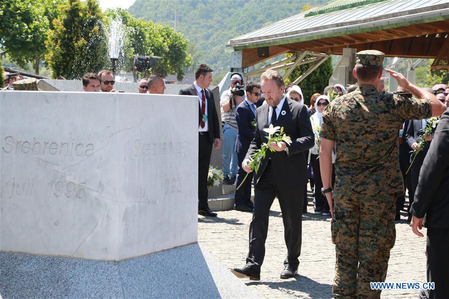 Bakir Izetbegovic, Chairman of the Bosnia and Herzegovina Presidency(C) pays respect to victims, at the Memorial Center in Potocari near Srebrenica, Bosnia and Herzegovina, on July 11, 2016. 