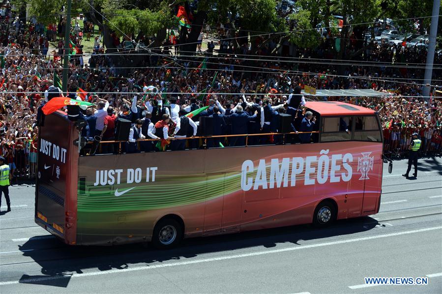 Portugal's national team members parade on a bus to the celebrating reception at the Presidential Palace in Lisbon, Portugal, July 11, 2016. 