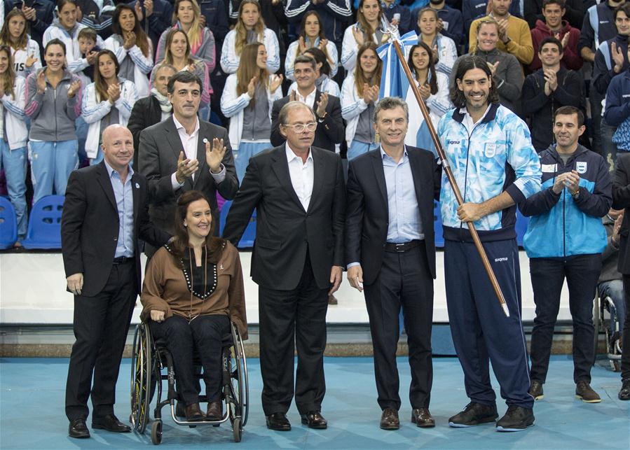 Argentine President Mauricio Macri (front, 2nd R) delievers flag of Argentine Olympic delegation to the basketball player Luis Scola during the farewell ceremony of Argentine Olympic delegation to the Rio 2016 Olympic and Paralympic Games in Buenos Aires, Argentine, on July 11, 2016. 