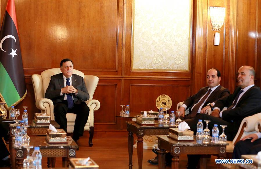 Libyan Prime Minister Fayez Serraj (Back) attends a meeting of the Government of National Accord (GNA) in Tripoli July 11, 2016. 