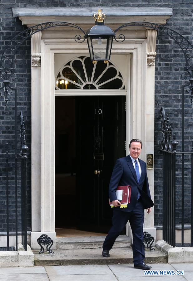 British Prime Minister David Cameron (1st L) leaves 10 Downing Street for his last Prime Minister's Questions in London, Britain, on July 13, 2016.