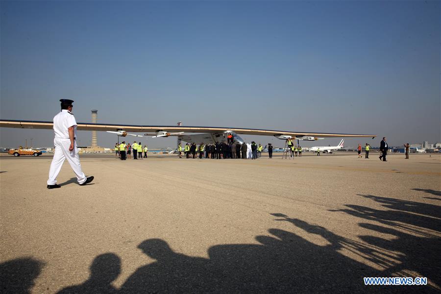 Swiss aviator Bertrand Piccard (1st L) and Andre Borschbergm (2nd L) are ready to be interviewed after the solar-powered aircraft Solar Impulse 2 arrived at the international airport in Cairo, capital of Egypt, on July 13, 2016.