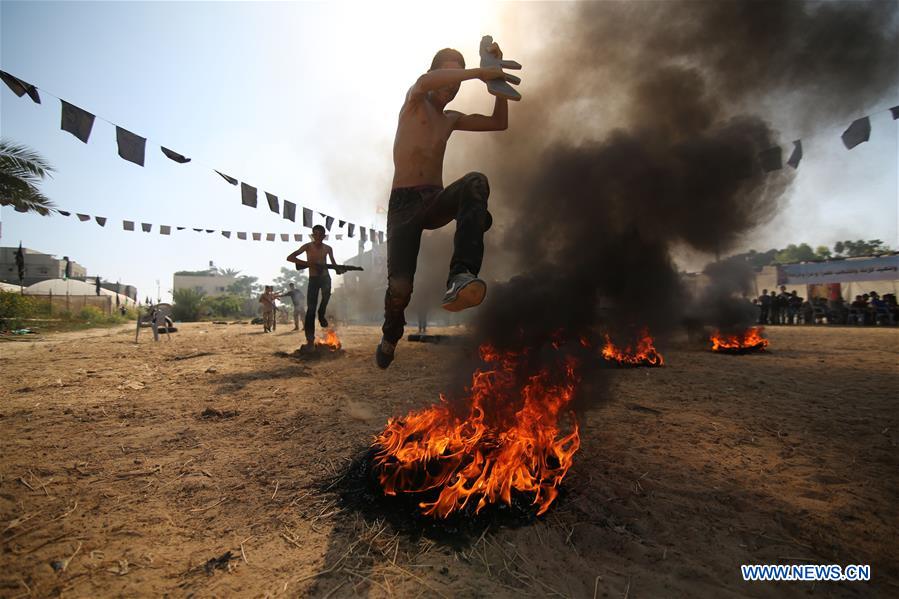 Palestinians take part in a military exercise at a summer camp, organized by Islamic Jihad movement, in the southern Gaza Strip City of Khan Younis, on July 13, 2016. 
