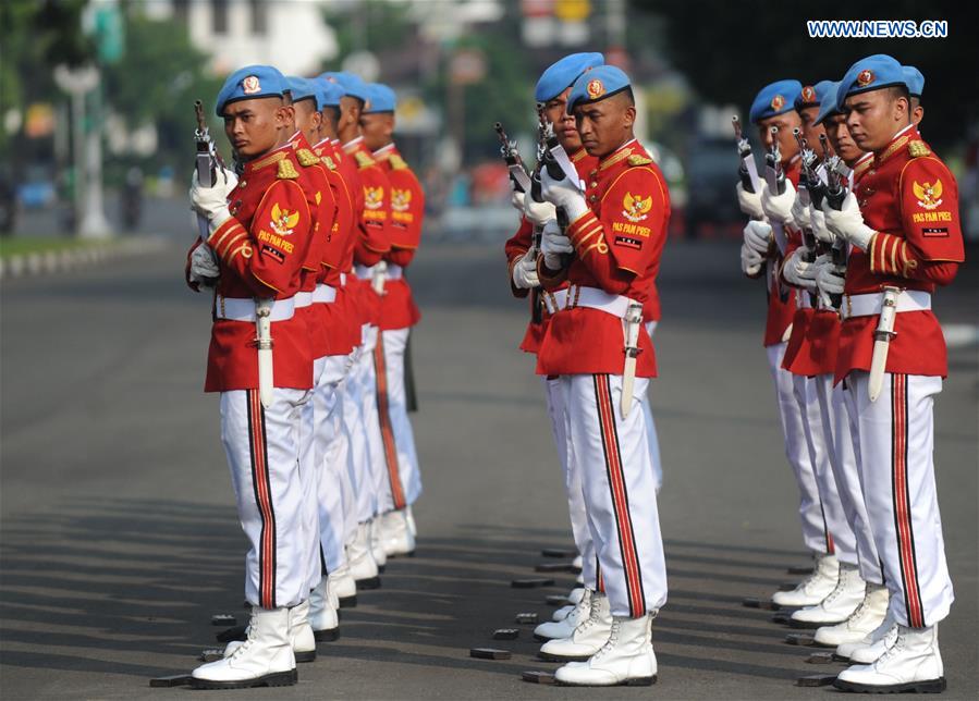 Soldiers of the Indonesian Guard of Honor perform during a show to the public in front of the Presidential Palace in Jakarta, Indonesia, July 17, 2016.