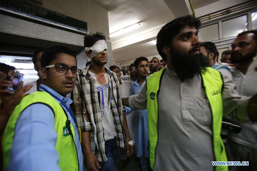 Kashmiri volunteers transfer a wounded person from an ambulance outside a hospital in Srinagar, summer capital of Indian-controlled Kashmir, on July 22, 2016. 