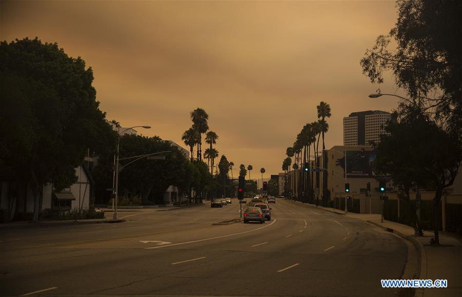 The city is wholly enveloped by smoke caused by wildfire in Los Angeles, the United States, on July 23, 2016.