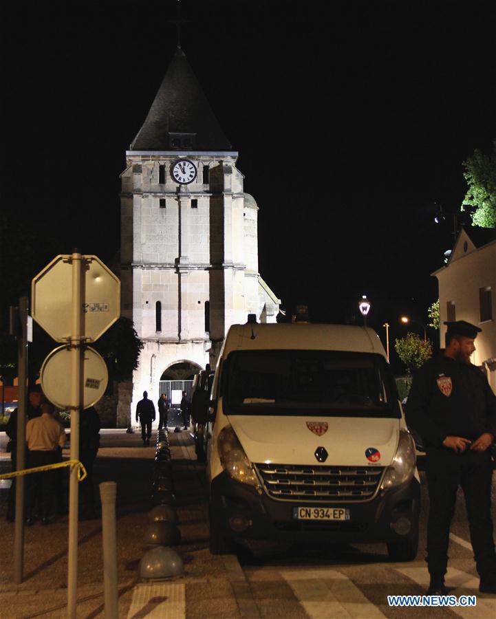 French police stand guard near the church which was attacked in Saint-Etienne-du-Rouvray, Seine-Maritime department, France, July 26, 2016.